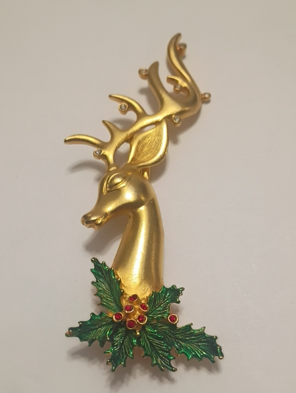 Vintage Gold Tone Reindeer Brooch with Green Enamel Holly Rhinestones Signed JJ